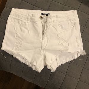 White ripped jean shorts